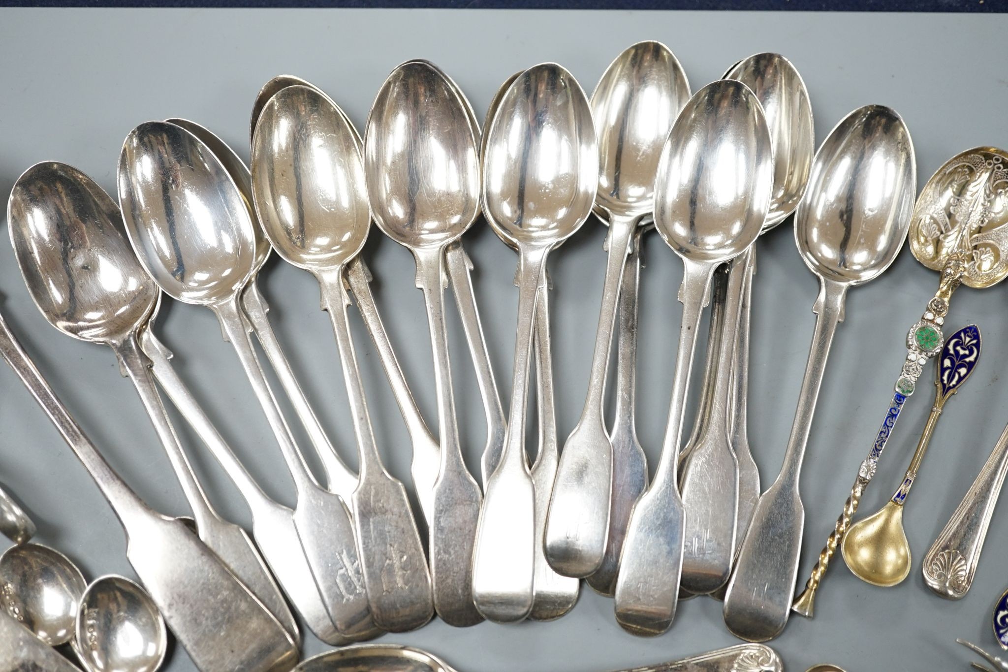 A set of twelve Victorian silver fiddle pattern teaspoons, London, 1870, a pair of Victorian sauce lades and a quantity of assorted sundry silver flatware